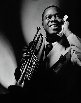 louis armstrong holding a trumpet anton bruehl